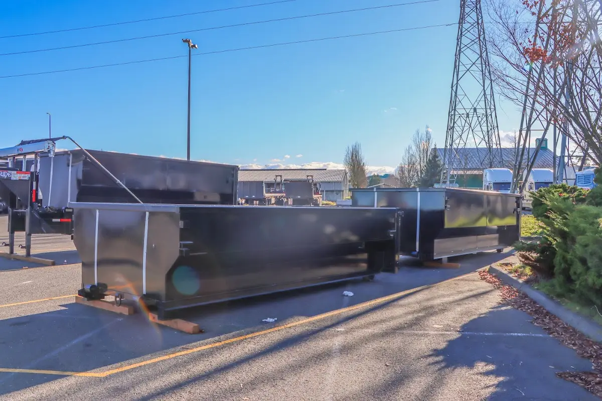 Roll-off dumpster ready for waste disposal at job site for Concrete Dumpster Rental in Hopkinton